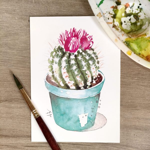 Postal con impresión de ilustración en acuarela de cactus con flor, en maceta celeste por Azahar Giner